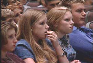 Students react when they see the photo of Sean Marsee with mouth cancer, in a scene from the new anti-smoking educational video.